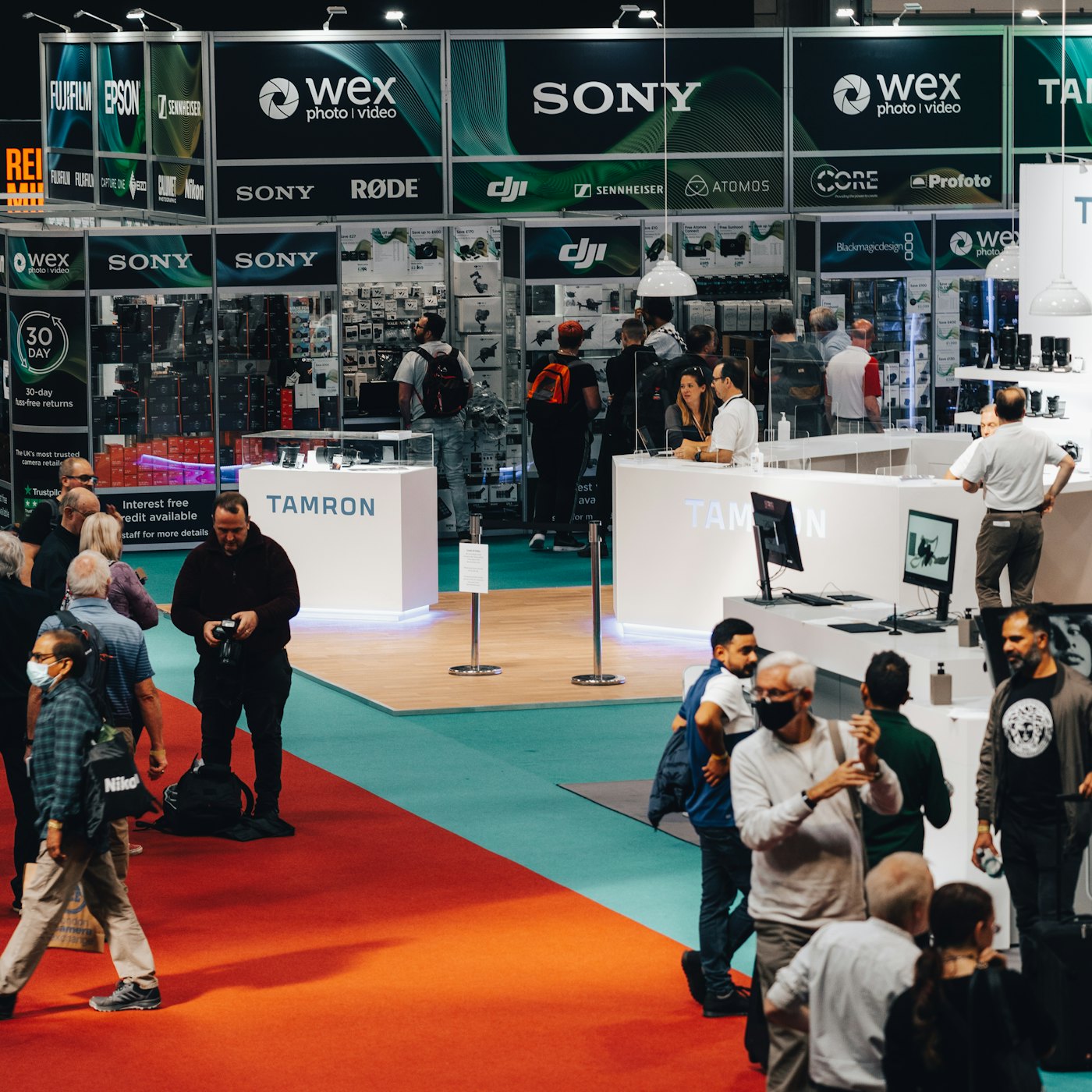 Exhibition hall with conference booths and attendees